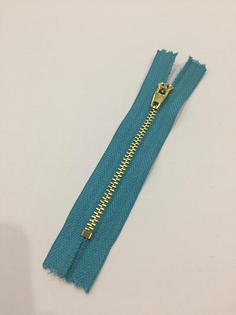 Молния джинсовая №4 золотой зуб 10см. Бирюзовый фото 1