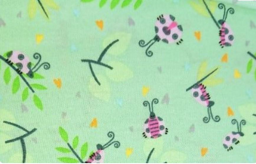 Кулирная гладь с лайкрой с рисунком Божьи коровки фон салатовый фото 1