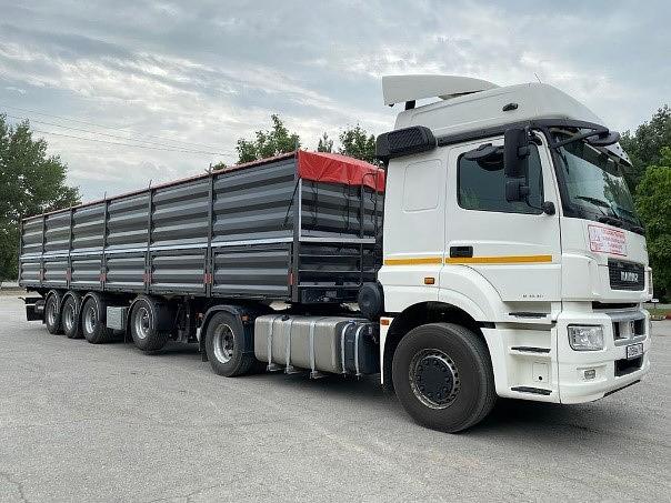 Полуприцеп-Зерновоз бортовой Тонар 99892 60 куб.м 3+1 ось фото 1