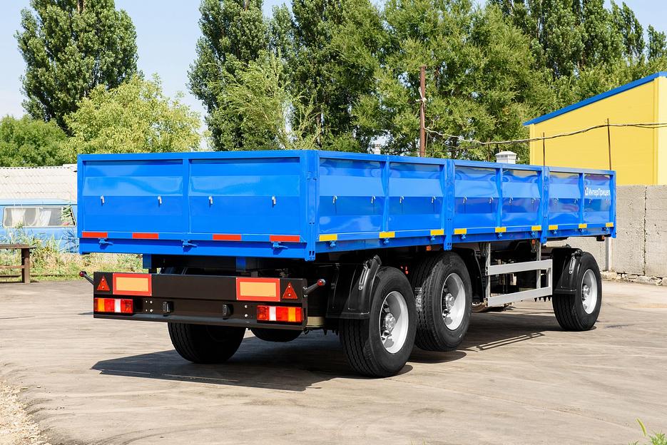 Прицеп бортовой трехосный фото 1