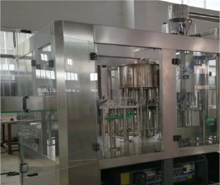 Машина для мойки, наполнения и укупорки газированной жидкости в бутылку JND883D фото 1