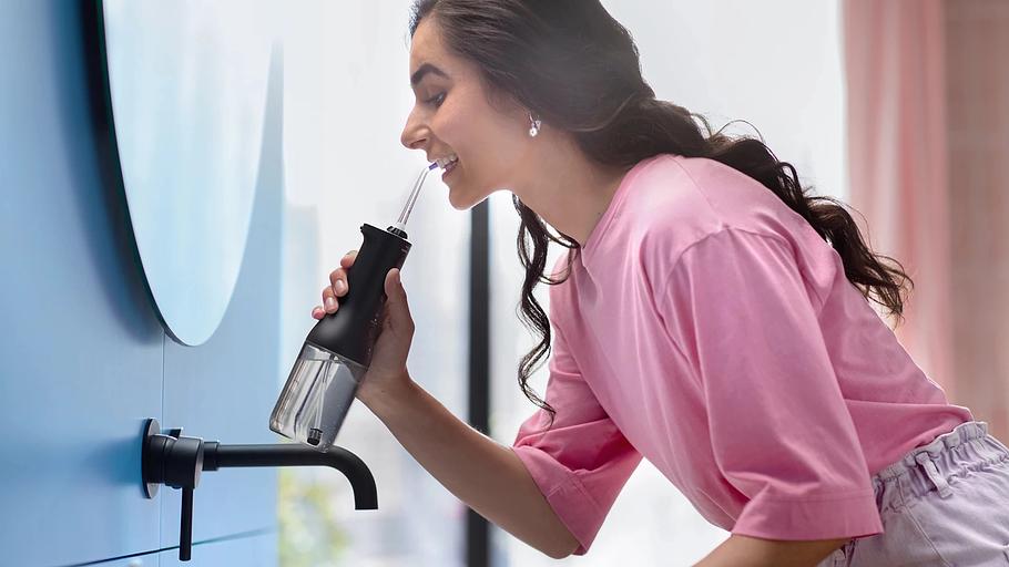 Ирригатор Philips HX3826/33 импульсн. черный фото 5