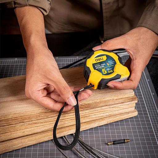 Измерительный и разметочный инструмент Deli Рулетка Deli DL3796 5м*19мм, Автостоп, ударопрочный корпус, метрическая фото 4